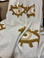 Plaid marocain pompons - brodé œil